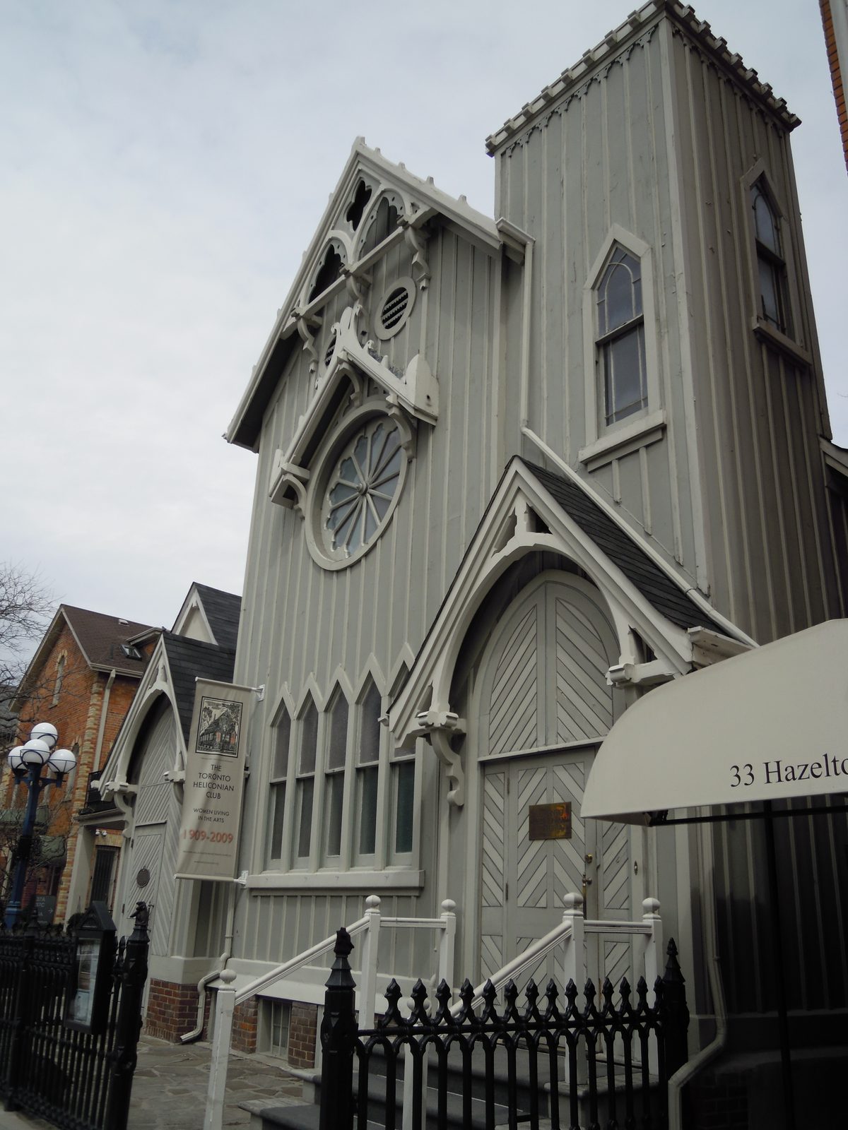 Hazelton Avenue streetscape showing historic Heliconian Hall across from 36 Hazelton